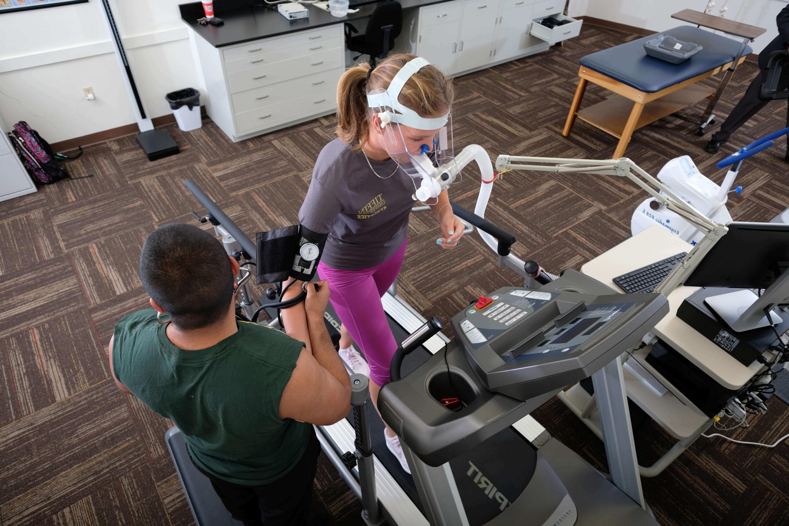 student on treadmill in lab